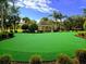 Lush putting green with manicured landscape and gazebo, ideal for leisurely afternoons at 7650 Comrow St # 403, Kissimmee, FL 34747