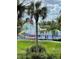 splash pad with water features, slides, and tropical-themed decorations in a gated community at 7650 Comrow St # 403, Kissimmee, FL 34747