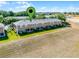 An aerial view of multi-Gathering units, featuring a green lawn and trees at 774 Chelsea Dr, Davenport, FL 33897