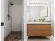 Nicely remodeled bathroom with shower and floating sink cabinet with modern mirror at 774 Chelsea Dr, Davenport, FL 33897