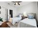 This bedroom features two twin beds and a wood floor, exuding a bright atmosphere at 774 Chelsea Dr, Davenport, FL 33897