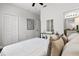 Bright bedroom featuring a closet, modern décor and a doorway to the bathroom at 774 Chelsea Dr, Davenport, FL 33897