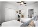 Bedroom with two twin beds, closet, and a decorative mirror on the wall at 774 Chelsea Dr, Davenport, FL 33897