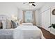 This bedroom features two twin beds, plush bedding, and a window for natural light at 774 Chelsea Dr, Davenport, FL 33897