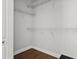 Walk-in closet with hardwood floor and white wire shelving for organized storage at 774 Chelsea Dr, Davenport, FL 33897
