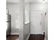 Entryway with a view into the kitchen, white trim, and wood flooring at 774 Chelsea Dr, Davenport, FL 33897