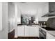 Modern kitchen offering views of the backyard and a stylish design with sleek cabinetry at 774 Chelsea Dr, Davenport, FL 33897