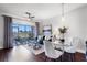 Bright living room features dining area and access to the patio with hardwood floors at 774 Chelsea Dr, Davenport, FL 33897