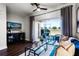 Inviting living room with a sliding glass door that leads out to a serene outdoor space at 774 Chelsea Dr, Davenport, FL 33897