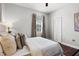 Well-lit bedroom featuring a comfortable bed, ceiling fan, and ample closet space at 774 Chelsea Dr, Davenport, FL 33897