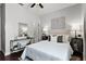 Cozy bedroom featuring ceiling fan, a comfortable bed and ample natural light at 774 Chelsea Dr, Davenport, FL 33897
