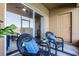 Cozy screened patio with wicker seating, a glass table, and calming blue cushions at 774 Chelsea Dr, Davenport, FL 33897