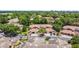 Community aerial view showcasing lush greenery, tile roofs, and ample parking at 7768 Sugar Bend Dr # 7768, Orlando, FL 32819