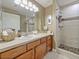 Bathroom featuring a vanity with a mirror and a walk-in shower at 7768 Sugar Bend Dr # 7768, Orlando, FL 32819