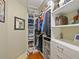 Walk-in closet with built-in shelving and drawers at 7768 Sugar Bend Dr # 7768, Orlando, FL 32819