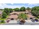 Exterior shot of the home featuring attached garages and beautiful landscaping at 7768 Sugar Bend Dr # 7768, Orlando, FL 32819