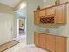 Entryway featuring tile floors, a coat closet and a built-in wine rack at 7768 Sugar Bend Dr # 7768, Orlando, FL 32819