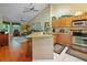 Bright open kitchen with stainless steel appliances and barstool seating at 7768 Sugar Bend Dr # 7768, Orlando, FL 32819