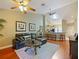 Bright living room with high ceilings, and access to the kitchen at 7768 Sugar Bend Dr # 7768, Orlando, FL 32819