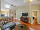 Spacious living room with tv and doorway to bedroom at 7768 Sugar Bend Dr # 7768, Orlando, FL 32819