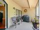 Inviting screened patio area with comfortable seating and outdoor grill at 7768 Sugar Bend Dr # 7768, Orlando, FL 32819