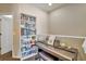 Piano and bookshelf in the alcove with natural light at 7819 Hardenton St, Windermere, FL 34786