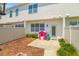 Cozy backyard featuring a small patio and mulch area, with playful outdoor toys at 7819 Hardenton St, Windermere, FL 34786