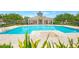 Community pool and pool house on a sunny day at 7819 Hardenton St, Windermere, FL 34786