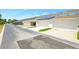 Row of townhome garages, one with solar panels on the roof and another with the door open at 7819 Hardenton St, Windermere, FL 34786