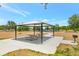 Picnic tables under a metal shelter next to the playground at 7819 Hardenton St, Windermere, FL 34786