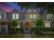 Inviting townhouse exterior showcasing a well-manicured landscape, private entrance, and warm, neutral color palette at 7819 Hardenton St, Windermere, FL 34786