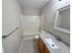 Bathroom featuring granite counter, tiled floors, and tub with shower at 786 Crystal Bay Ln, Orlando, FL 32828