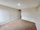 An empty bedroom with beige carpet and neutral-colored walls, ready for personalization at 786 Crystal Bay Ln, Orlando, FL 32828