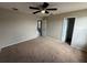 Bedroom featuring neutral walls, carpet, and doors to closet and entry at 786 Crystal Bay Ln, Orlando, FL 32828