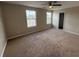 A well lit bedroom featuring neutral walls, carpeting, and a ceiling fan at 786 Crystal Bay Ln, Orlando, FL 32828