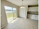 Dining area featuring sliding glass doors to a large lake view and access to outdoor living at 786 Crystal Bay Ln, Orlando, FL 32828