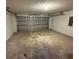 Empty garage with metal door and concrete floors at 786 Crystal Bay Ln, Orlando, FL 32828