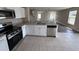 Open kitchen with stainless steel dishwasher and oven, and granite countertop at 786 Crystal Bay Ln, Orlando, FL 32828