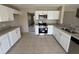 Kitchen features stainless steel appliances, granite countertops, and white cabinets at 786 Crystal Bay Ln, Orlando, FL 32828