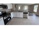 Kitchen features stainless steel appliances, granite countertops, and white cabinets at 786 Crystal Bay Ln, Orlando, FL 32828