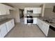 Bright kitchen with white cabinets, stainless steel appliances, and granite countertops at 786 Crystal Bay Ln, Orlando, FL 32828