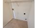 Cozy laundry room with tile flooring and wire shelving, ready for appliances at 786 Crystal Bay Ln, Orlando, FL 32828