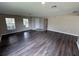 Hardwood flooring and lots of windows provide ample light in this living room at 786 Crystal Bay Ln, Orlando, FL 32828