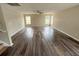 Spacious Living Room featuring laminate wood flooring at 786 Crystal Bay Ln, Orlando, FL 32828