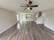 Spacious living room with hardwood flooring, ceiling fan, and plenty of natural light at 786 Crystal Bay Ln, Orlando, FL 32828