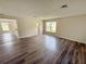 An open floorplan featuring new laminate wood flooring and ample lighting at 786 Crystal Bay Ln, Orlando, FL 32828