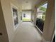 Enclosed side porch with multiple windows allowing ample light at 786 Crystal Bay Ln, Orlando, FL 32828