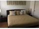 Comfortable bedroom with a plush bed, decorative pillows, and stylish bedside lamps at 8973 Lee Vista Blvd # 2308, Orlando, FL 32829