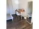 Well-lit bedroom with a desk, chair, large mirror, and neutral color scheme at 8973 Lee Vista Blvd # 2308, Orlando, FL 32829