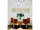 Elegant dining area with stylish table, chairs, modern light fixtures and artwork at 8973 Lee Vista Blvd # 2308, Orlando, FL 32829